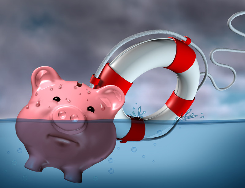 pink piggy bank and white and red life preserver floating in water.